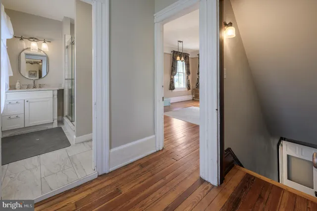 a house view with swimming pool in front of it