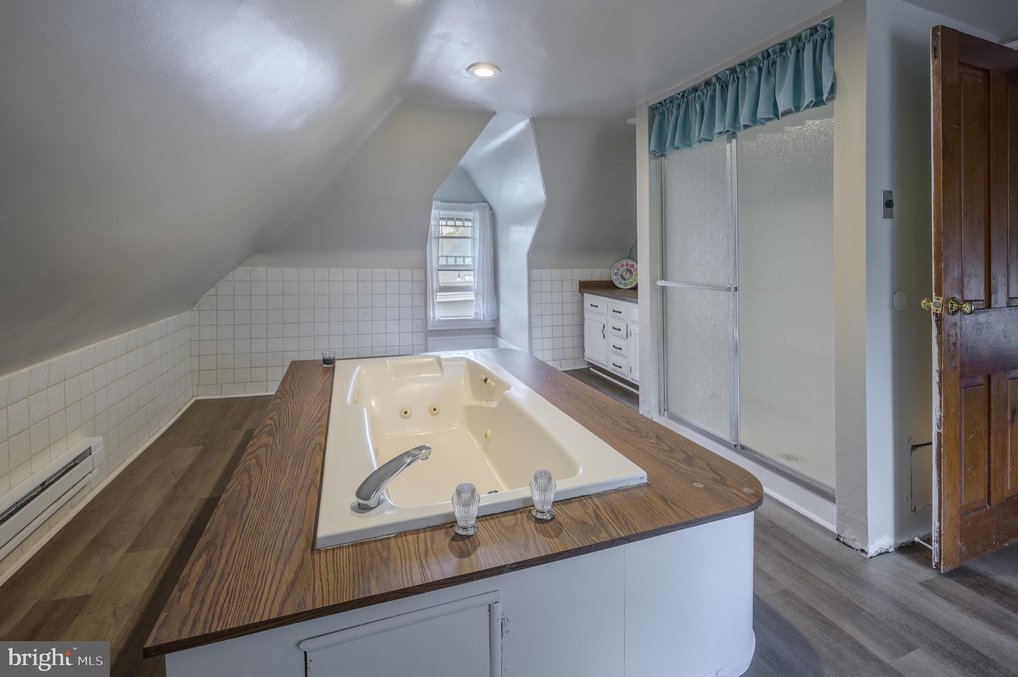 48 Broad Street Mount Holly, NJ 08060 - Photo 47 of 63 a view of kitchen island with stainless steel appliances granite countertop refrigerator sink and stove