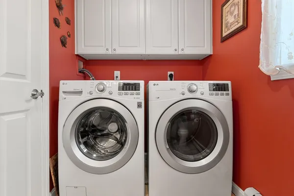 a utility room with dryer and washer