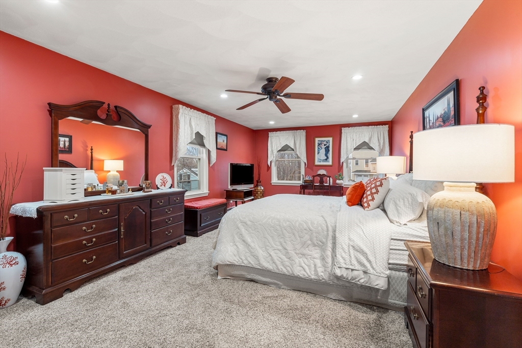 27 Folger Avenue Beverly, MA 01915 - Photo 18 of 34 a bedroom with a bed and a dresser in it