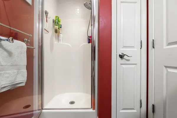 a bathroom with a bathtub and shower