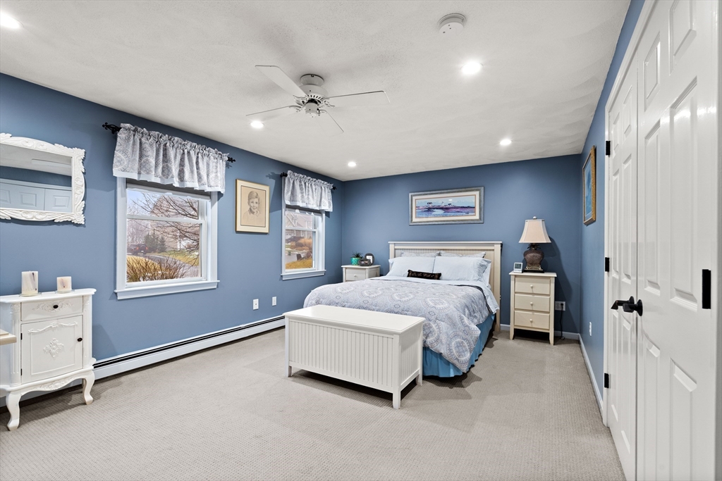 27 Folger Avenue Beverly, MA 01915 - Photo 21 of 34 a spacious bedroom with a bed and a dresser