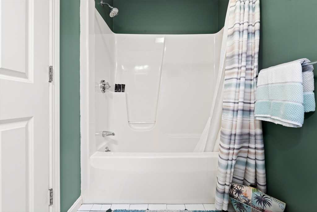 27 Folger Avenue Beverly, MA 01915 - Photo 27 of 34 a bathroom with a bathtub and shower