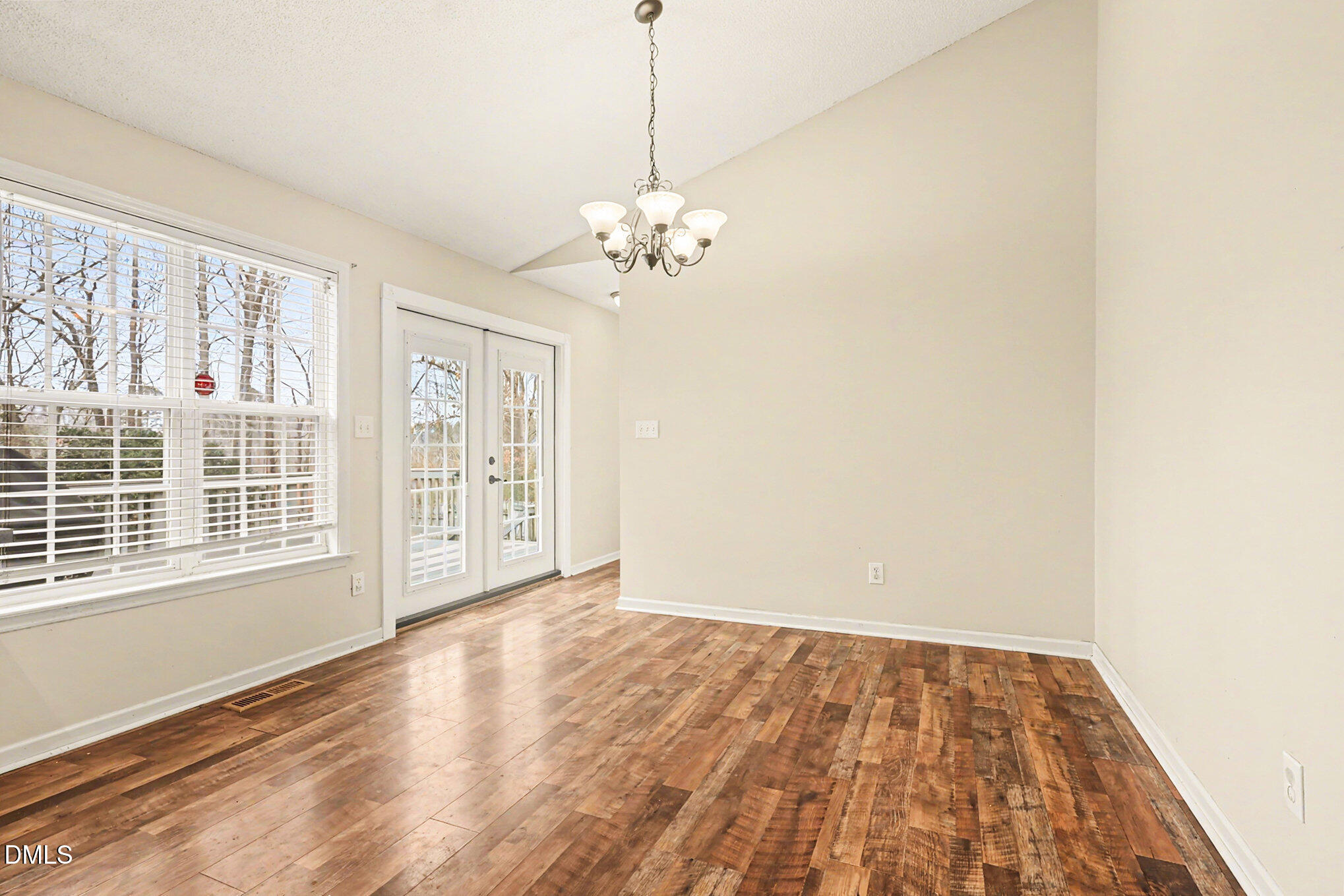 186 Turtle Point Drive Fuquay-Varina, NC 27526 - Photo 12 of 33 a view of an empty room with a window