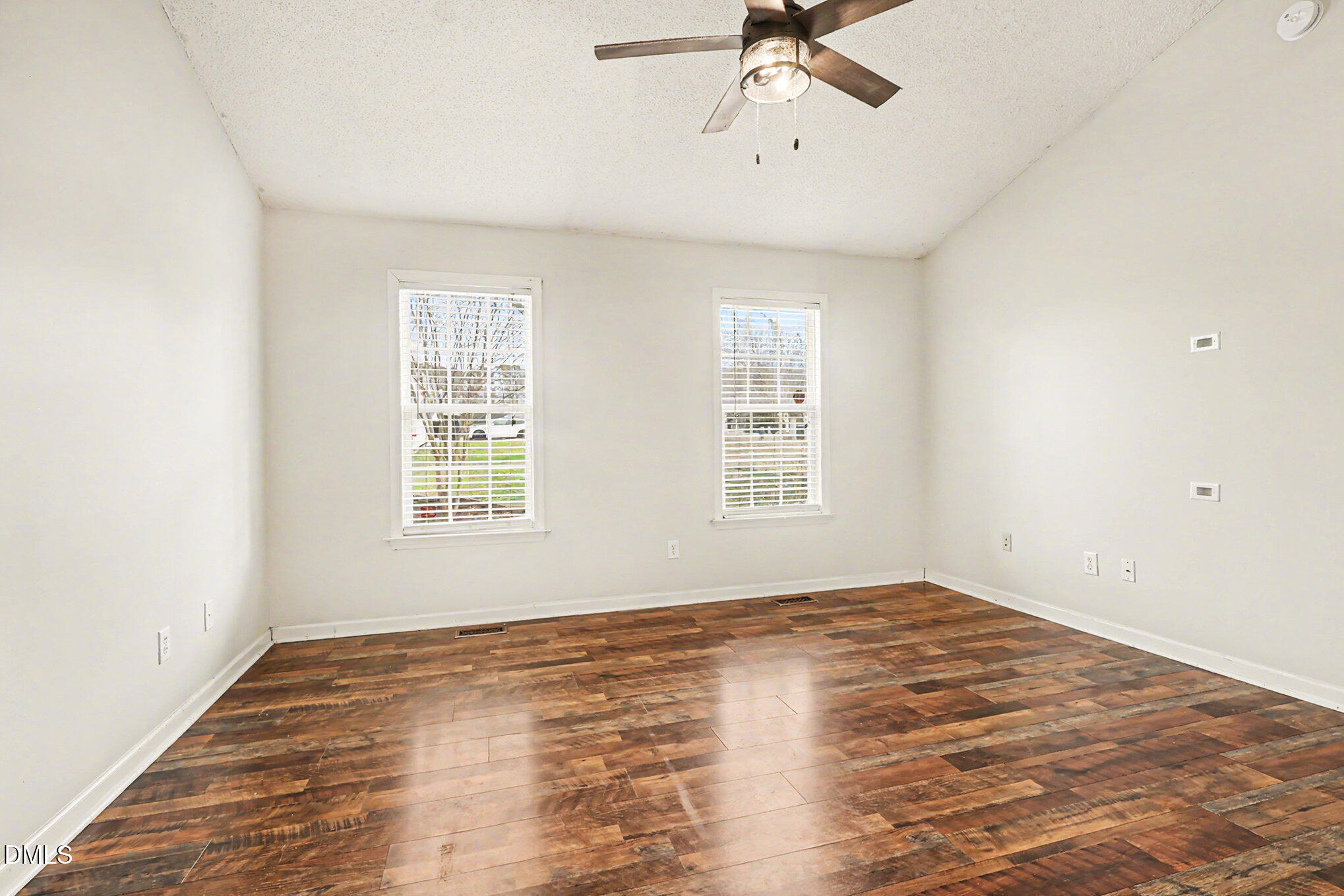 186 Turtle Point Drive Fuquay-Varina, NC 27526 - Photo 14 of 33 a view of empty room with wooden floor and fan