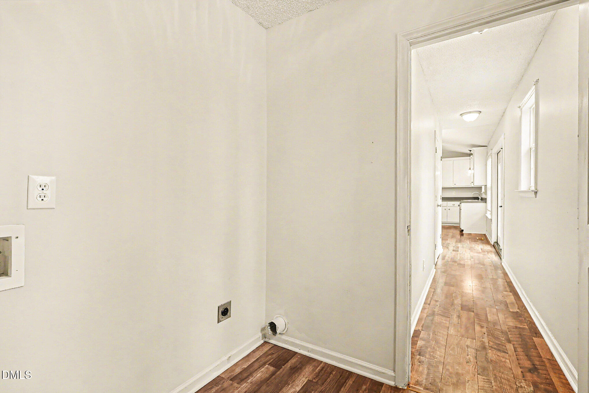 186 Turtle Point Drive Fuquay-Varina, NC 27526 - Photo 19 of 33 a view of a room with wooden floor and a bathroom