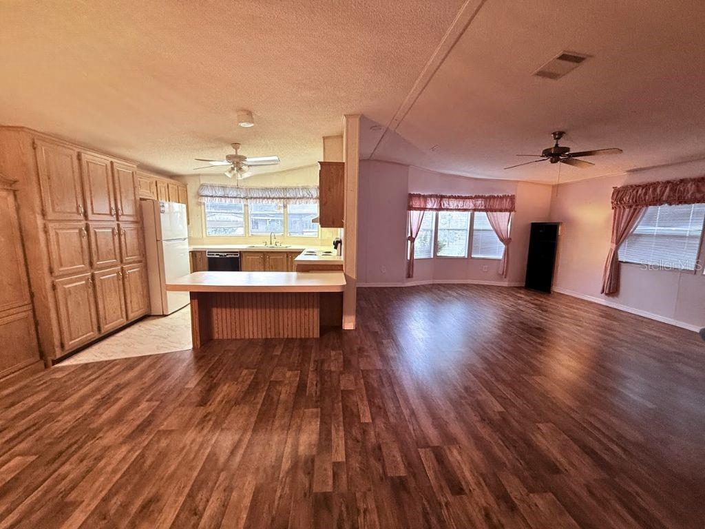 220 Ellsworth Drive Kissimmee, FL 34758 - Photo 18 of 40 a living room with furniture and a wooden floor