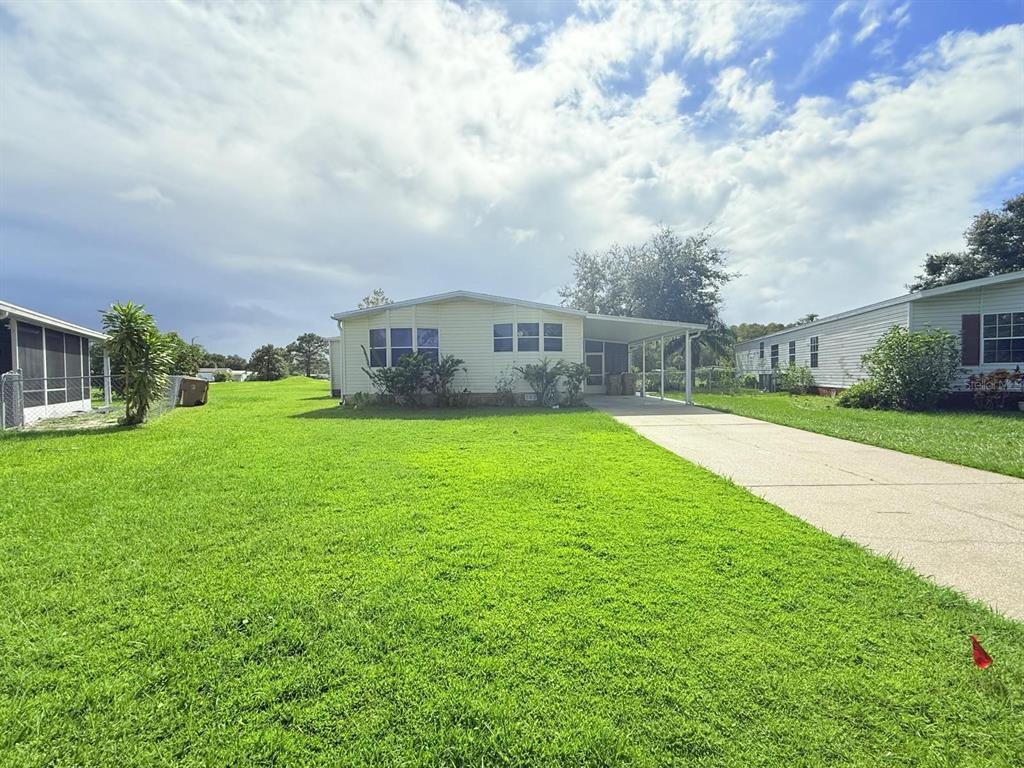 220 Ellsworth Drive Kissimmee, FL 34758 - Photo 2 of 40 a view of a house with a big yard