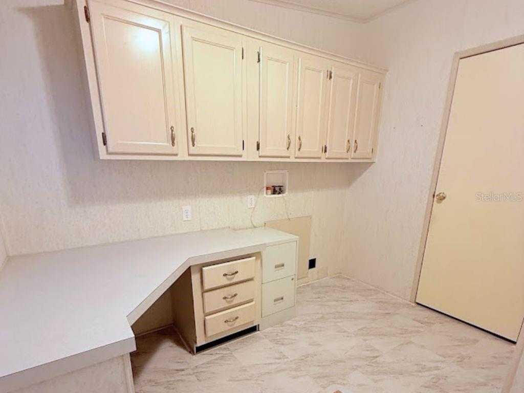 220 Ellsworth Drive Kissimmee, FL 34758 - Photo 33 of 40 a view of an empty room with cabinet
