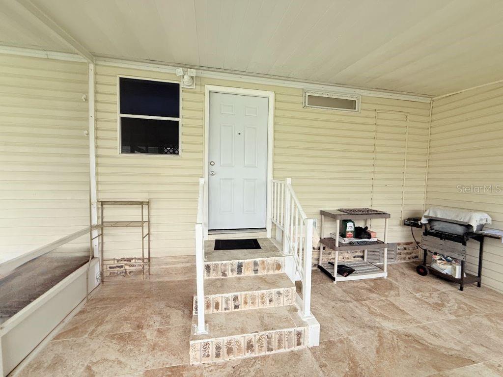 220 Ellsworth Drive Kissimmee, FL 34758 - Photo 35 of 40 a view of a livingroom with furniture and front door
