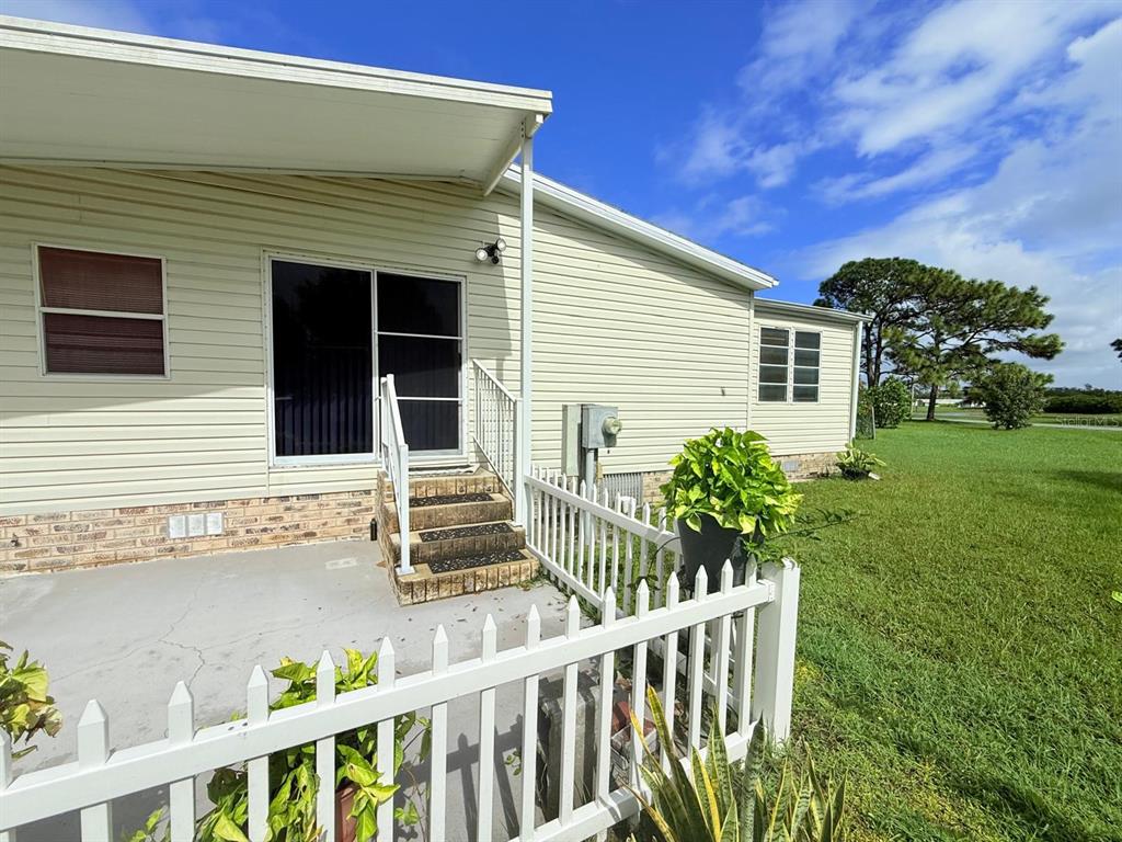 220 Ellsworth Drive Kissimmee, FL 34758 - Photo 8 of 40 a front view of house with yard