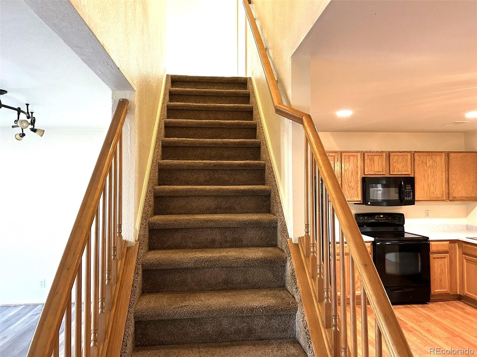 9325 Welby Rd Terrace Denver, CO 80229 - Photo 7 of 21 a view of entryway and kitchen