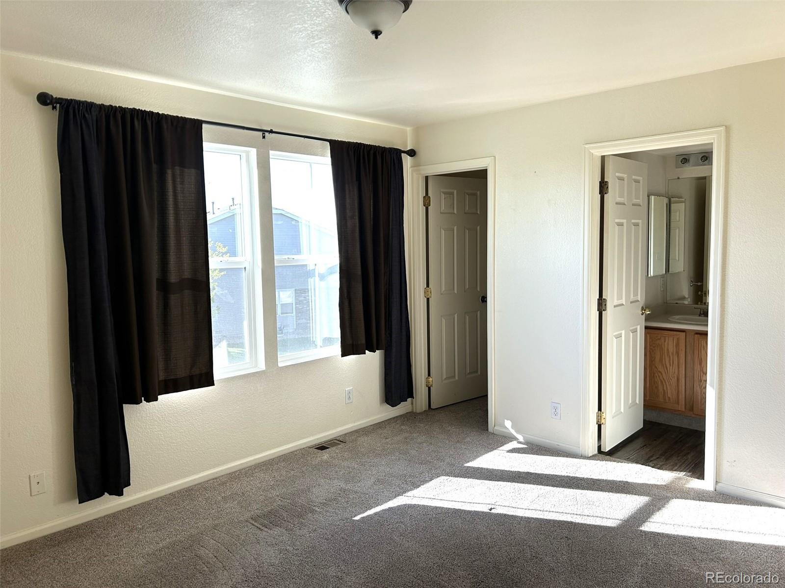 9325 Welby Rd Terrace Denver, CO 80229 - Photo 8 of 21 a view of a room with a large window