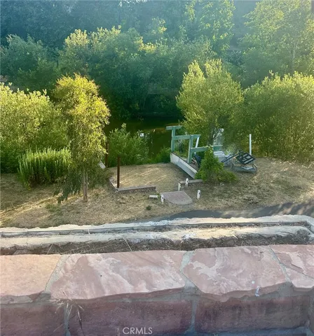 a view of a backyard of the house