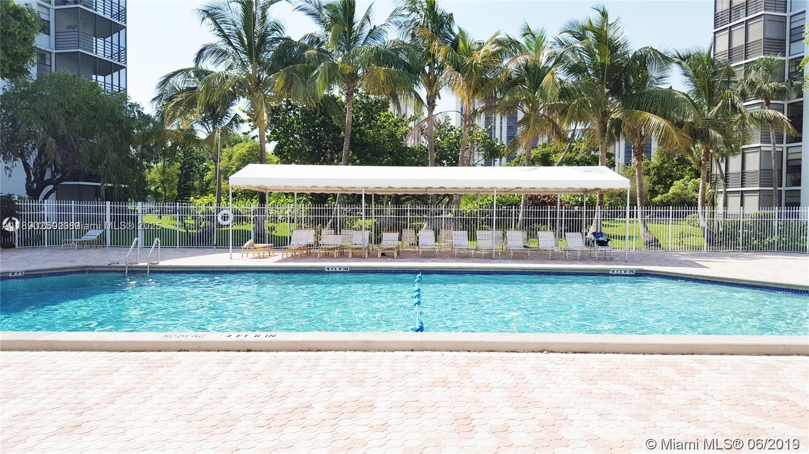 20400 West Country Club Drive, Unit 410 Aventura, FL 33180 - Photo 6 of 7 a view of a porch with a yard