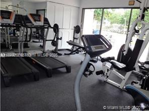 20400 West Country Club Drive, Unit 410 Aventura, FL 33180 - Photo 7 of 7 a view of a room with gym equipment