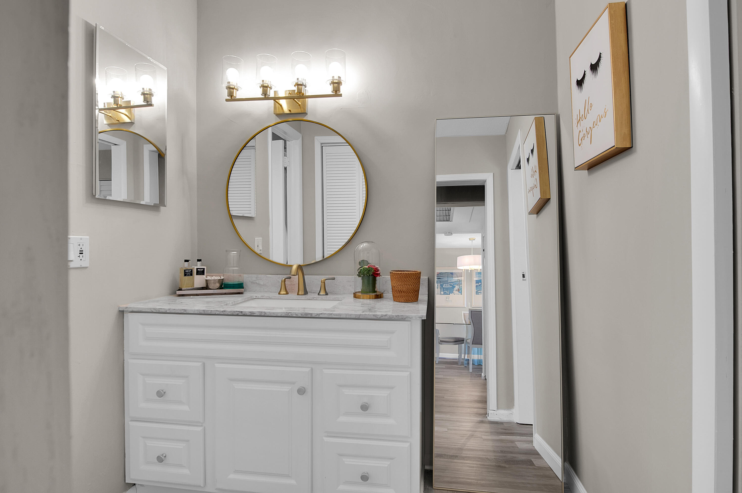 312 Northeast 17th Avenue, Unit 202 Boynton Beach, FL 33435 - Photo 20 of 44 a bathroom with a sink and a mirror