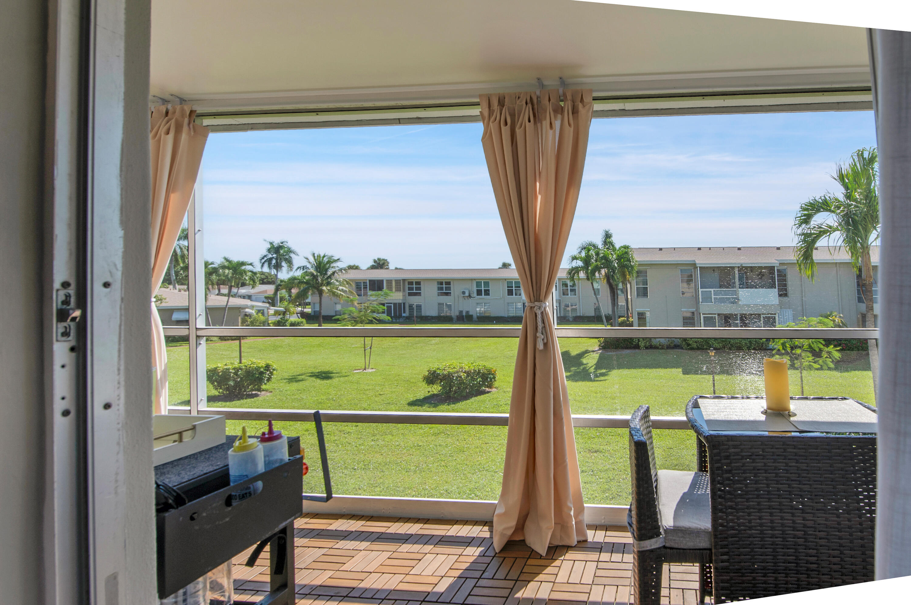 312 Northeast 17th Avenue, Unit 202 Boynton Beach, FL 33435 - Photo 24 of 44 a view of a balcony with a lake view
