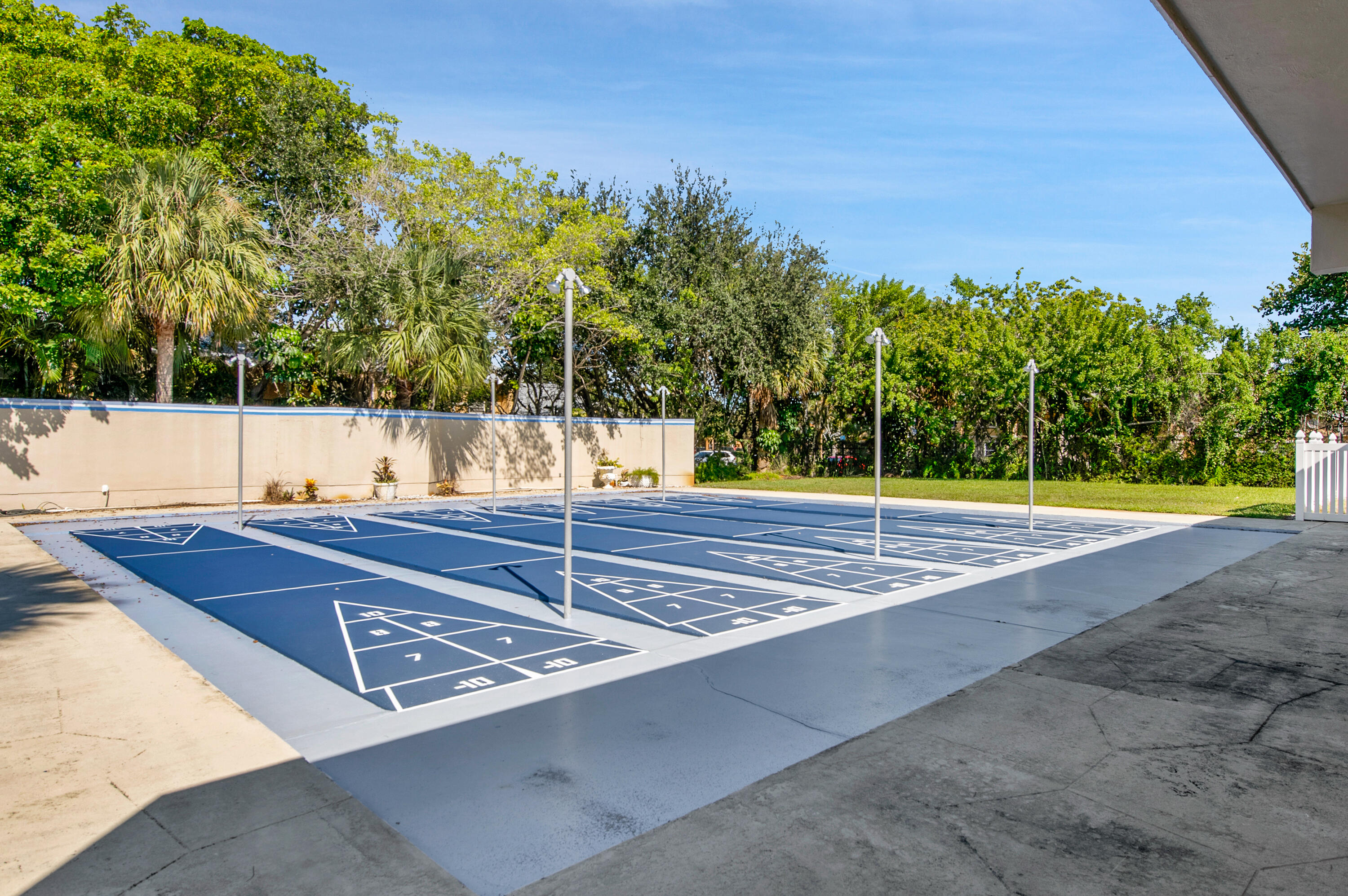 312 Northeast 17th Avenue, Unit 202 Boynton Beach, FL 33435 - Photo 30 of 44 a view of a tennis court