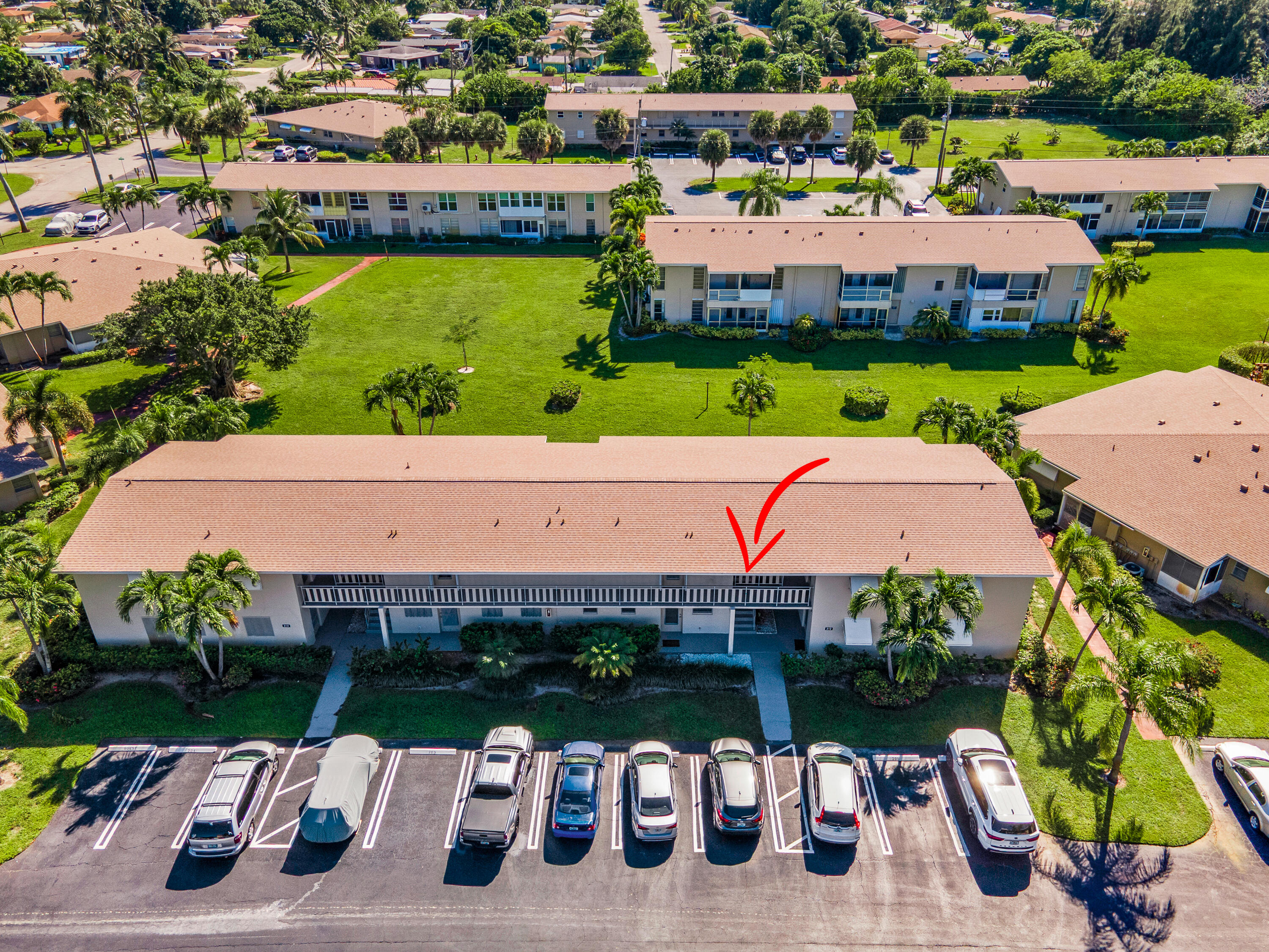 312 Northeast 17th Avenue, Unit 202 Boynton Beach, FL 33435 - Photo 40 of 44 an aerial view of a house with garden space and street view