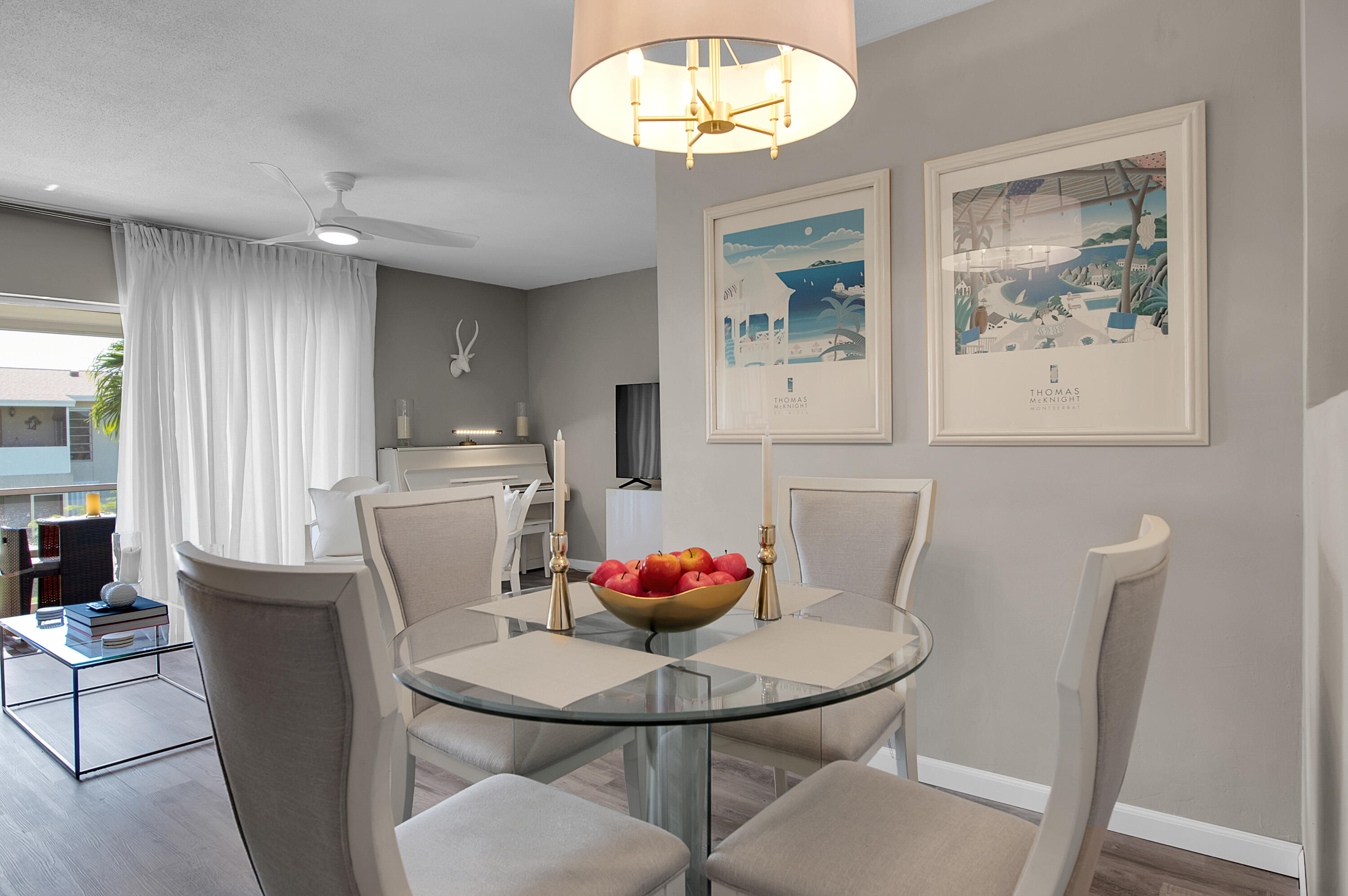 312 Northeast 17th Avenue, Unit 202 Boynton Beach, FL 33435 - Photo 9 of 44 a view of a dining room with furniture and chandelier