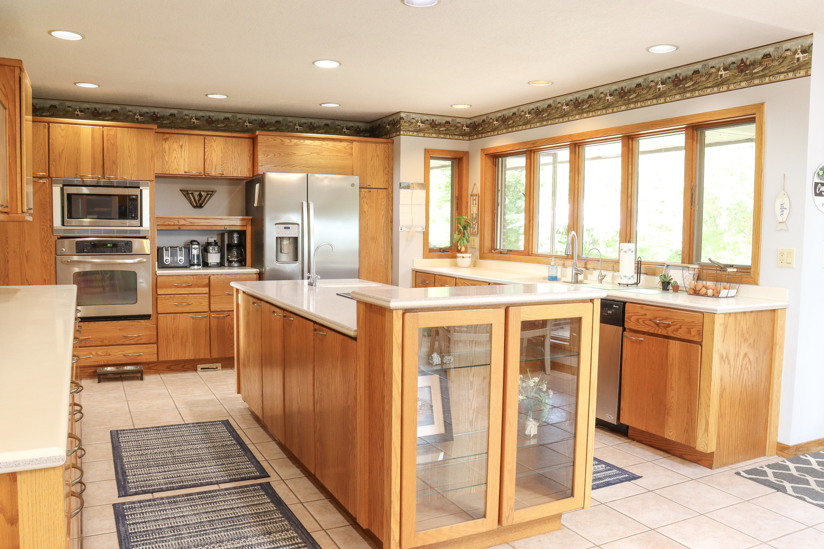 16181 Sand Road Fulton, IL 61252 - Photo 14 of 57 a kitchen with stainless steel appliances granite countertop a stove and cabinets