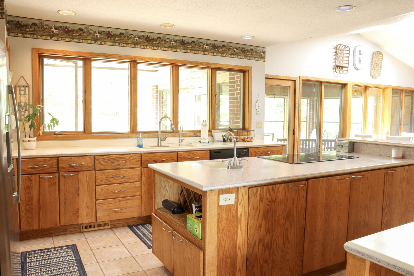 16181 Sand Road Fulton, IL 61252 - Photo 15 of 57 a kitchen with stainless steel appliances granite countertop a sink a stove and a wooden cabinets