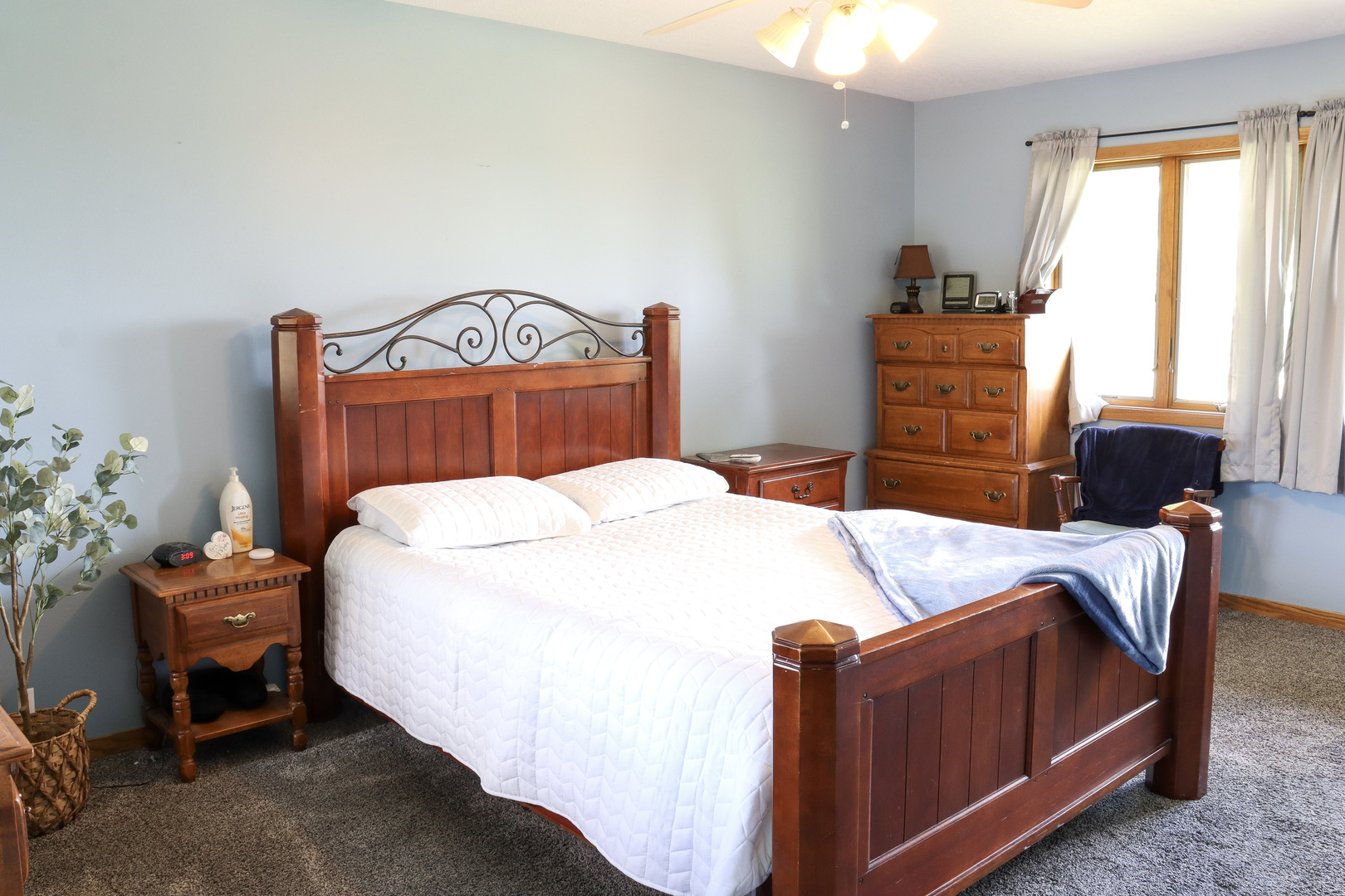 16181 Sand Road Fulton, IL 61252 - Photo 23 of 57 a bed sitting in a bedroom next to a window