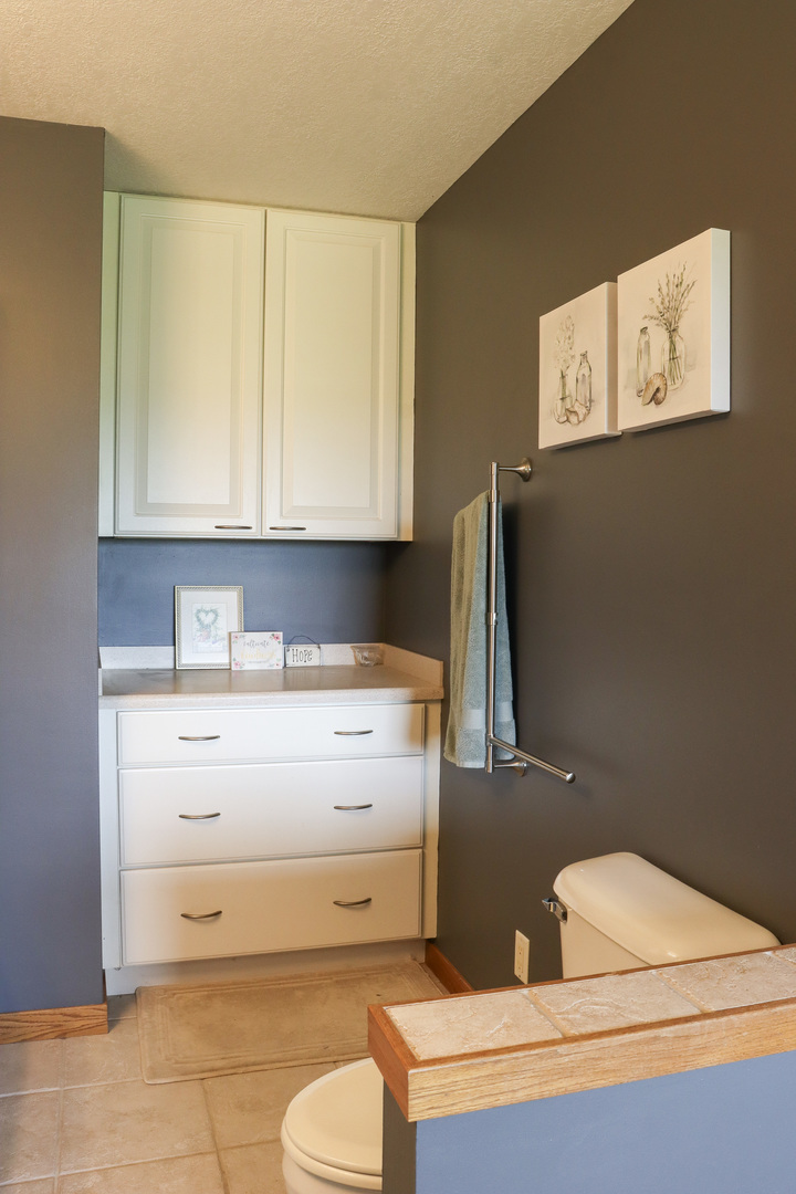16181 Sand Road Fulton, IL 61252 - Photo 28 of 57 a bathroom with a sink a toilet and a mirror