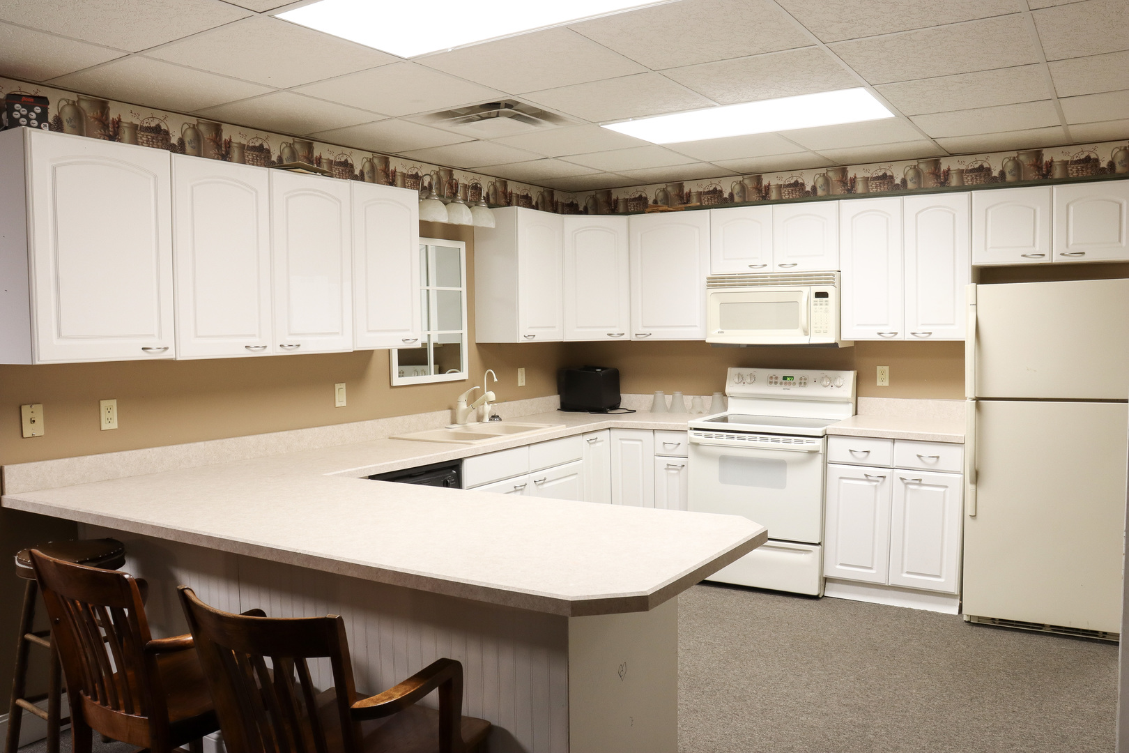 16181 Sand Road Fulton, IL 61252 - Photo 31 of 57 a kitchen with granite countertop a sink appliances cabinets and furniture