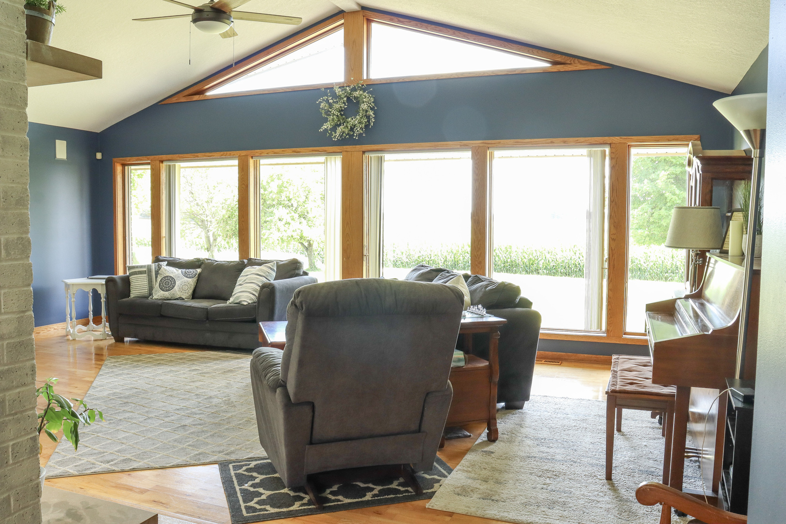 16181 Sand Road Fulton, IL 61252 - Photo 9 of 57 a living room with furniture and a floor to ceiling window