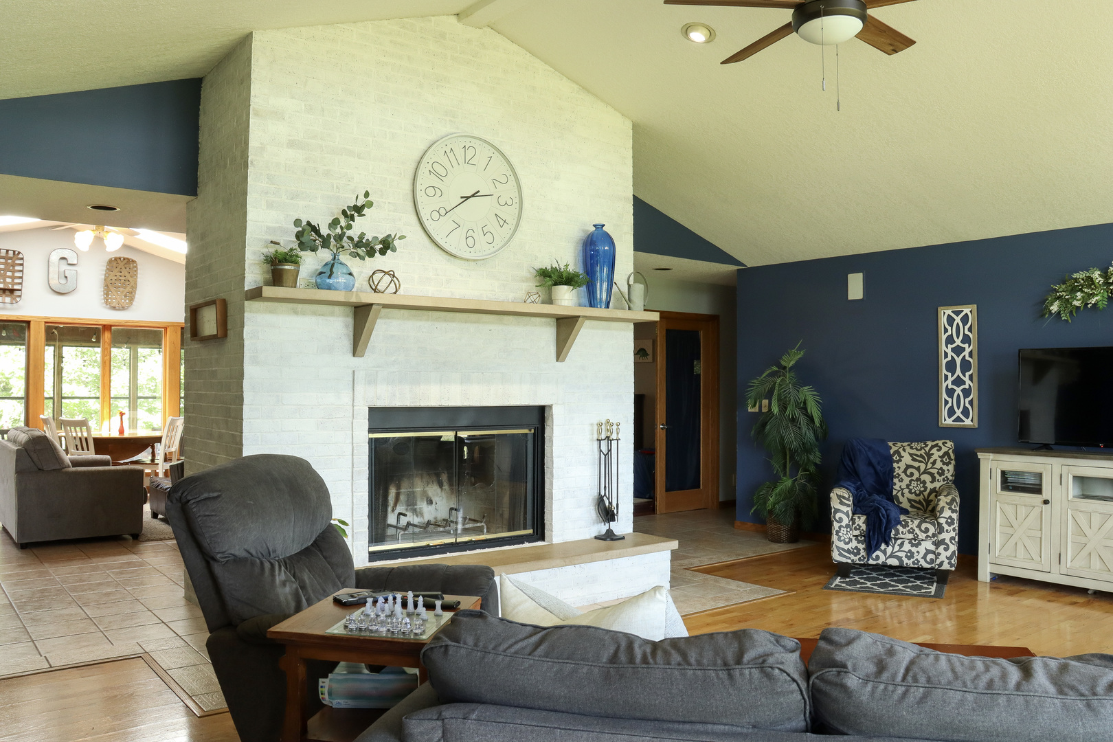 16181 Sand Road Fulton, IL 61252 - Photo 10 of 57 a living room with furniture a flat screen tv and a fireplace