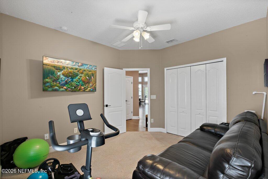 841 Ifield Road St. Augustine, FL 32095 - Photo 38 of 69 a bed room with a bed a couch and a window