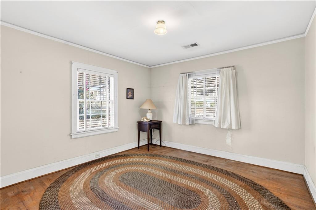 804 Berkeley Avenue Northwest Atlanta, GA 30318 - Photo 11 of 21 a spacious bedroom with a bed and a window