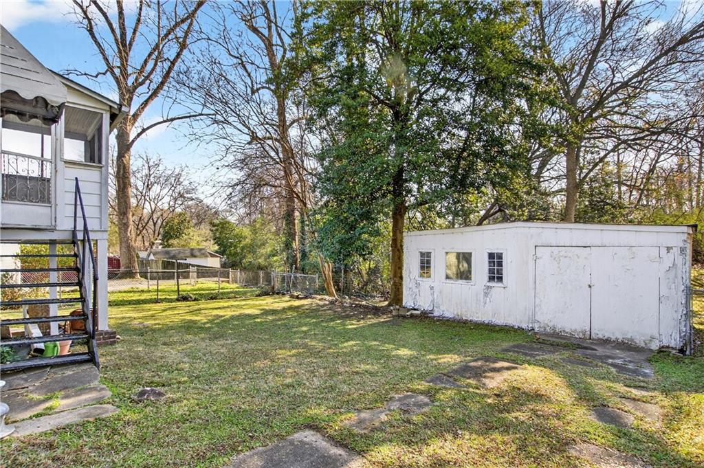 804 Berkeley Avenue Northwest Atlanta, GA 30318 - Photo 17 of 21 a view of a house with backyard and trees