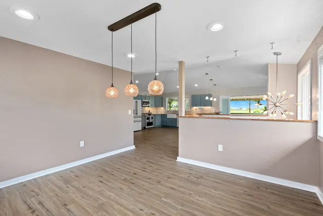 a view of a kitchen and a window