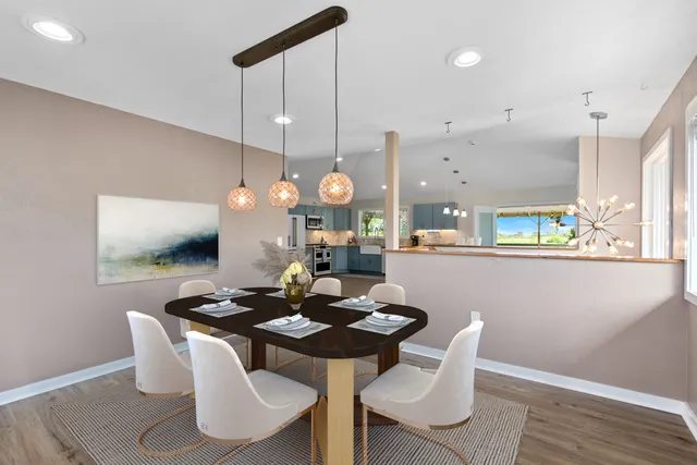 a kitchen with a table and chairs in it