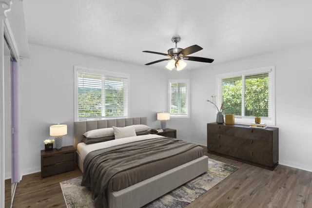 a bedroom with a large bed and a window