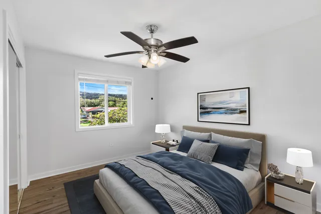 a bedroom with bed and a window