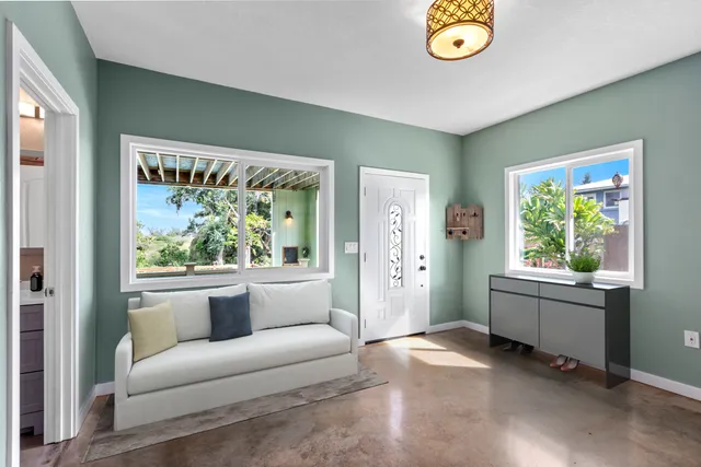 a living room with furniture and a large window