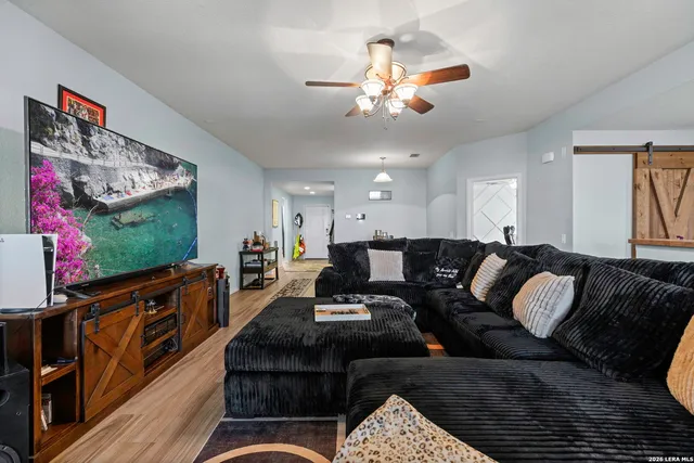 a living room with furniture and a flat screen tv