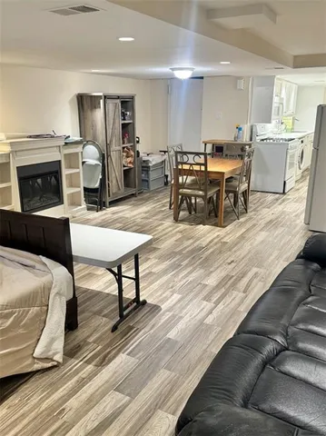 a kitchen with kitchen island a stove a sink and a refrigerator