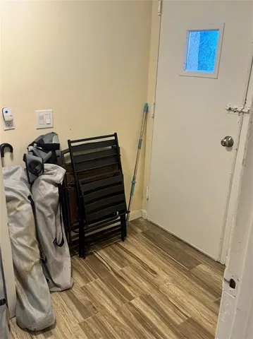 a view of a balcony with wooden floor and outdoor seating