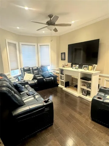 a dining room with furniture and a chandelier