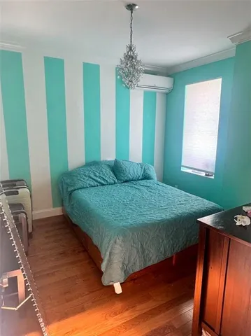 a view of walk in closet with clothes