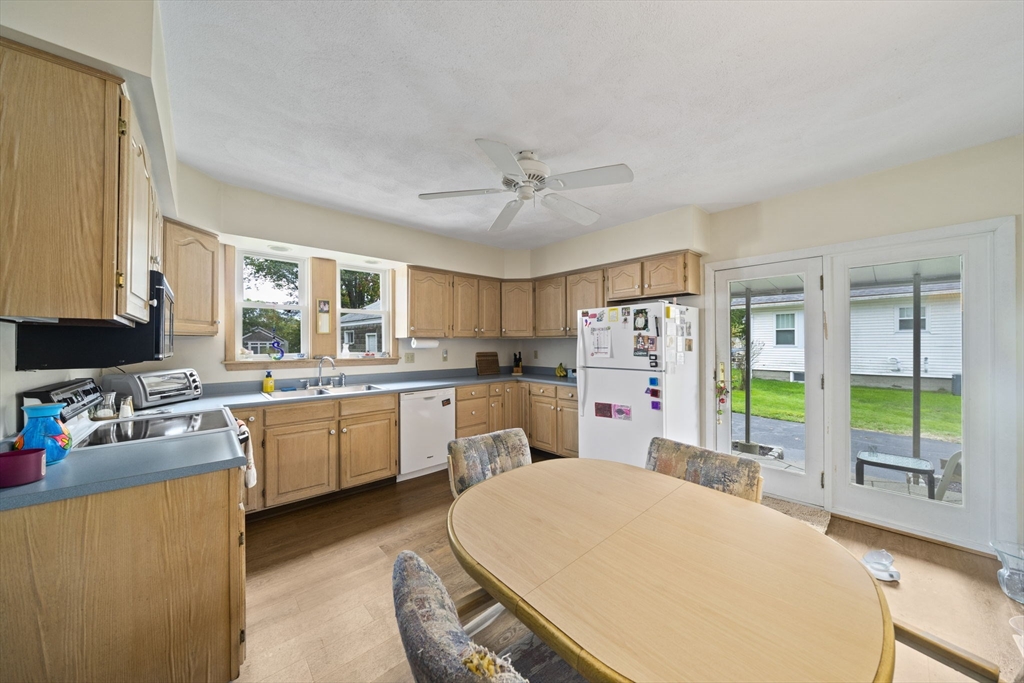 619 North Main Street Mansfield, MA 02048 - Photo 5 of 28 a very nice looking room with a large window a sink and a dining table