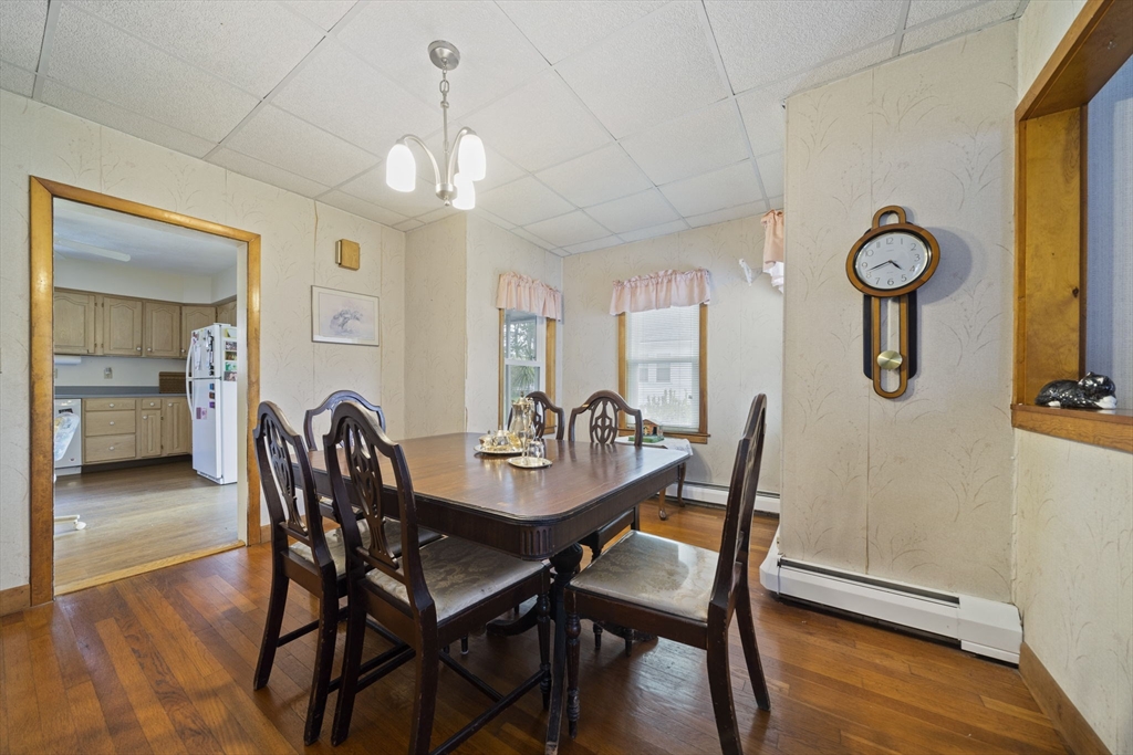 619 North Main Street Mansfield, MA 02048 - Photo 9 of 28 a view of a dining room with furniture window and wooden floor