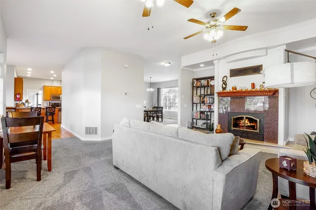 a living room with furniture and a fireplace