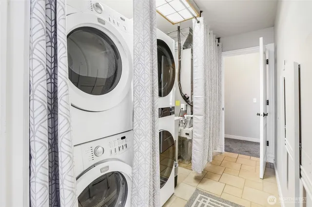 a view of a hallway with washer and dryer