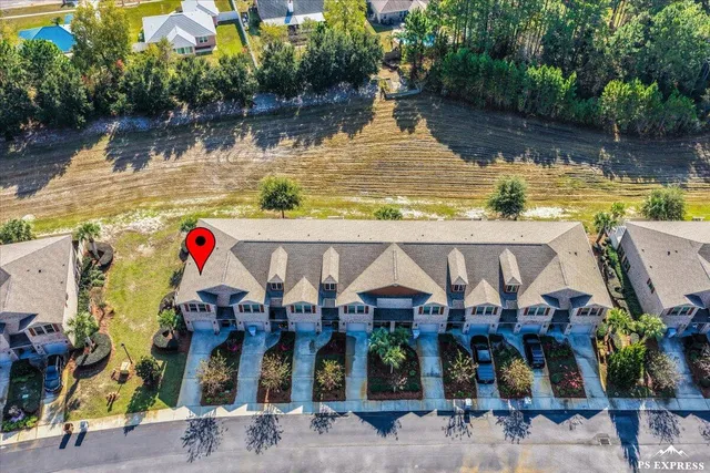 an aerial view of house with yard swimming pool and outdoor seating